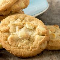 White Chocolate Macadamia Nut Cookie · Freshly baked cookie with white chocolate chips and macadamia nut chunks. Contains nuts.
