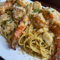 Gnarlic Gnoodles with Calamansi Jumbo Shrimp · Garlic noodles tossed in garlic oyster sauce and garlic butter. Topped with 6 fried garlic c...
