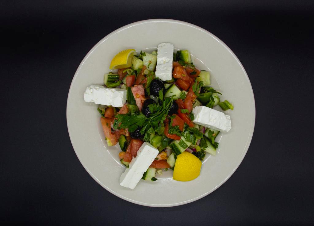 Shepherd's Salad · Tossed tomatoes, cucumbers, peppers, onions, parsley, red onions and green onions with vinegar and oil.