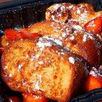 Apple French Toast · French Toast challah bread stufffed with our house made Apple mix garnished with strawberries.