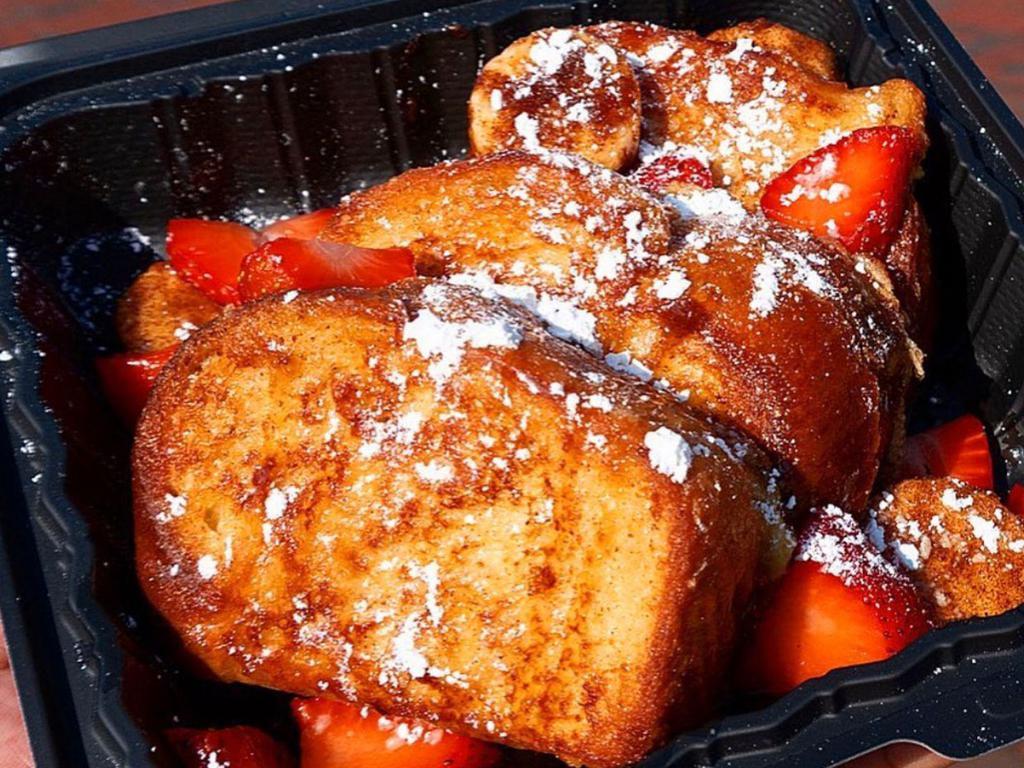 Apple French Toast · French Toast challah bread stufffed with our house made Apple mix garnished with strawberries.