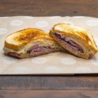 Flashback Reuben Sandwich · Served hot. Pastrami brisket, sauerkraut, Swiss cheese, and 1000 Island dressing. Served on ...