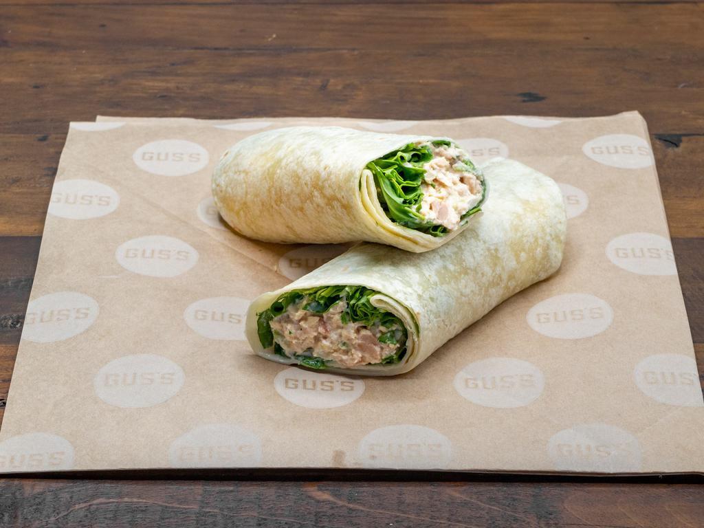 Tuna Wrap · Tuna salad made with tuna, mayo, celery, red onions, whole grain mustard, salt, and pepper. Comes in a flour tortilla with Asiago cheese and wild arugula.