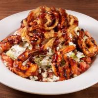 BBQ Bleu Wedge Salad · Wedge of iceberg lettuce topped with house-made bleu cheese dressing, signature BBQ sauce, d...