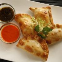 Gaucho Chicken Empanada · Natural chicken with onions, red bell pepper and tomato sauce.