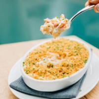 King Crab Mac & Cheese · Artisanal pasta cooked with mornay sauce, truffle, and 1/4lb of King Crab. Finished with bre...