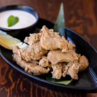 Deep Fried Chicken Karaage · Deep fried bite-size chicken marinated in sake and Ushio special spices. Served with mild sp...