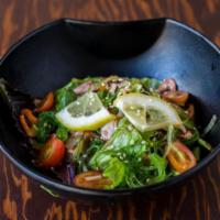 Tako Sunsai Salad · Thinly sliced octopus with wakame, mixed greens and toasted sesame seeds, tossed in light Ja...