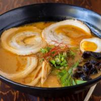 Ushio Spicy Miso Ramen · Homemade noodles in spicy chicken miso broth, topped with braised pork chashu, soft boiled e...