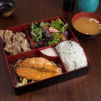 Grilled Salmon Bento Box · Served with miso soup and mixed greens salad.