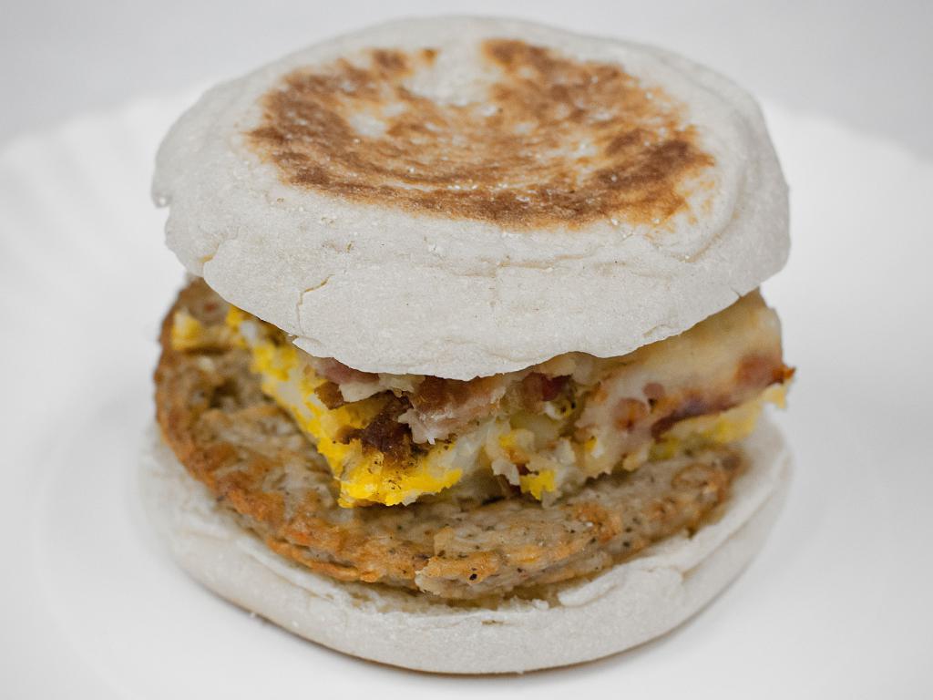 Breakfast Sandwich · English muffin, sausage patty, hash brown, eggs, bacon and cheese.