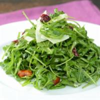Baby Arugula Salad  · With baby arugula, dried cranberries, honey almonds, Manchego cheese and housemade lemon vin...