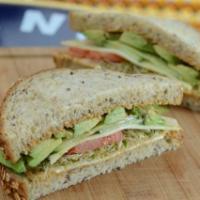 Avocado and Cheddar Sandwich · With fresh avocado, tomato, alfalfa sprouts, cucumber and housemade spicy mayo on light mult...