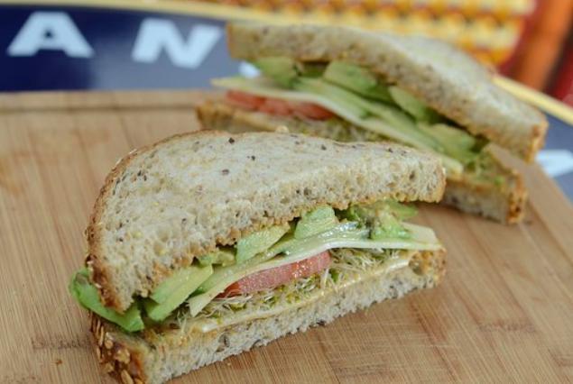 Avocado and Cheddar Sandwich · With fresh avocado, tomato, alfalfa sprouts, cucumber and housemade spicy mayo on light multigrain bread.