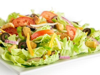 Garden Salad · Iceberg lettuce, bell peppers, red onions, black olives, fresh roma tomatoes, mozzarella cheese, cheddar cheese, seasoned croutons, and your choice of dressing.