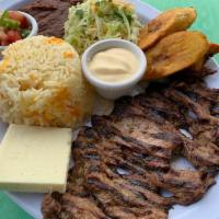 Carnitas Tipicas · Grilled steak, rice, beans, fried cheese, plantains, cream, and cabbage. Carne asada,arroz, ...