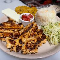Pollo A La Plancha · Wtih rice, beans, fried cheese, plantains, cream, and cabbage. Con arroz, frijoles, queso fr...
