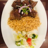 7. Lamb Kabob · Chunks of tender lamb, marinated in special spices, garlic and broiled on skewers over charc...