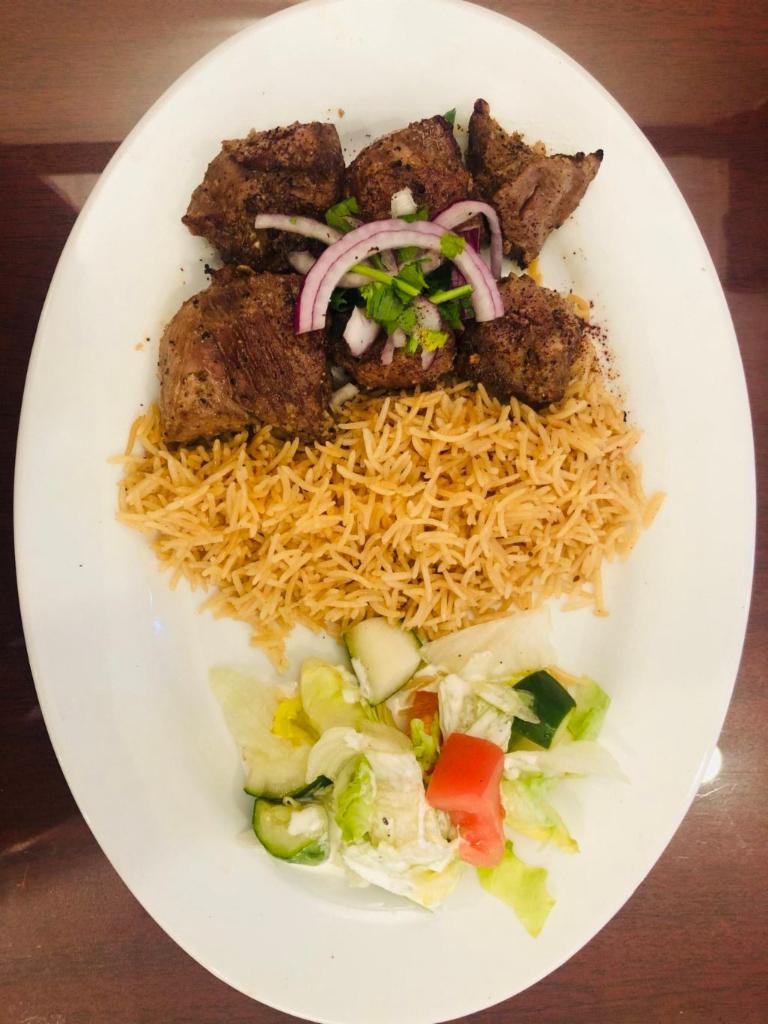 7. Lamb Kabob · Chunks of tender lamb, marinated in special spices, garlic and broiled on skewers over charcoal. Served with fresh homemade bread.
