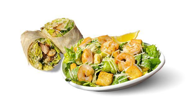 Caesar Salad · Romaine, garlic croutons, parmesan, lemon squeeze, cracked black pepper, caesar dressing, house flatbread.
