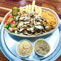 Shawarma (chicken) · Comes with rice, lettuce, Israeli salad, hummus, baba ganouch, tahini and fries 