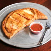Chicken Calzone · Chicken, green peppers, onions, provolone, mozzarella, and sauce wrapped in fresh dough.