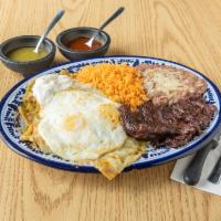 Chilaquiles con 1/2 Carne Asada y Dos Huevos Desayuno · 2 eggs served with a grilled skirt and steak and chilaquiles.