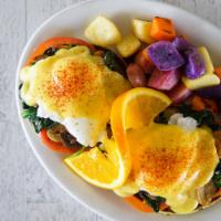 Eggs Benedict Florentine · Mushroom, spinach and tomato on top of our homemade English muffin covered with hollandaise ...