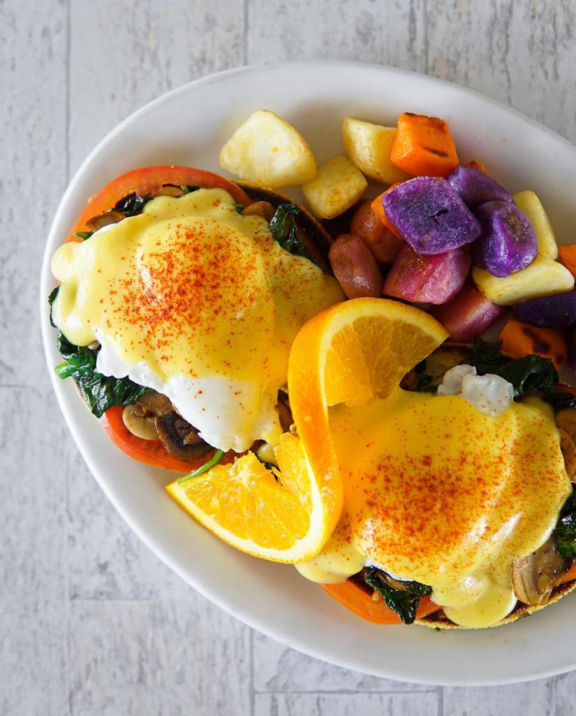 Eggs Benedict Florentine · Mushroom, spinach and tomato on top of our homemade English muffin covered with hollandaise sauce and comes with a side of steamed rice, seasoned home-fried potatoes or 3 fluffy buttermilk pancakes.