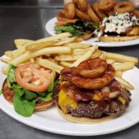 Paniolo BBQ Burger · 2 onion rings on top and guava BBQ sauce.