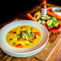 Sopa Tlalpeno · Traditional Mexican chicken soup, with fresh vegetables, white rice and garbanzo beans. Garn...
