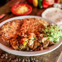 Carnitas Uruapan · We slow cook our juicy pork carnitas for hours, until they are melt in your mouth tender and...