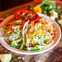 Tijuana Steak Tacos · Traditional soft corn tortillas filled with tender steak, pico de gallo, lettuce and mixed s...