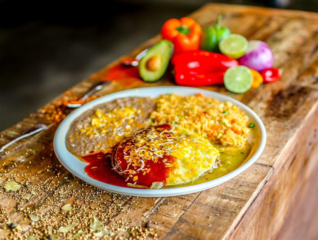 Enchiladas Sonora · Our favorite enchilada recipe prepared in our very unique way, layers of chicken, shredded beef and mixed shredded cheese. Topped with tomatillo, Mexican crema, enchilada sauce and sure to satisfy all of your cravings! Gluten free.