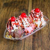 Banana Split · Chocolate and strawberry ice cream, fresh banana, strawberry sauce, chocolate sauce, whipped...