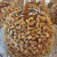Caramel and Nuts Apple · Caramel covered Granny Smith Apple rolled with the nuts of your choice.