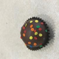 Birthday Truffle · Delicious milk chocolate shell filled with white chocolate cake batter filling and sprinkles