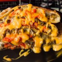Hot Cheeto Quesadilla · Quesadilla With Choice Of Meat, Nacho Cheese, And Hot Cheese