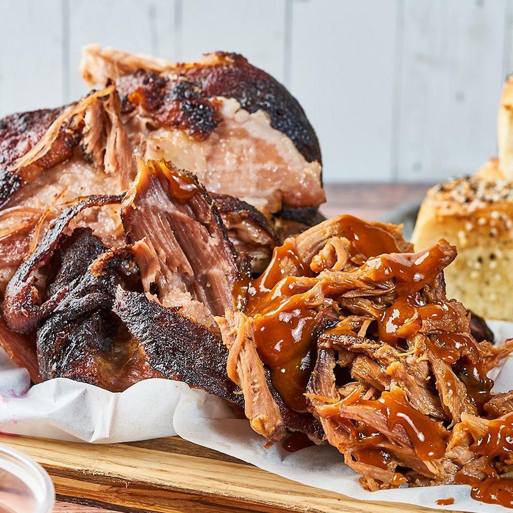 BBQ Pulled Pork by Mac 'n Cue · By Mac 'n Cue by International Smoke. Smoked slowly in our wood smoker and tossed with smokey mama BBQ sauce. We cannot make substitutions.