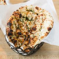 133. Garlic Chili Naan · All-purpose flour bread topped with garlic and green chili made in Tandoor.