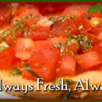 Bruschetta · Fresh tomatoes, red onions, garlic, basil, oregano, olive oil, and balsamic vinegar dusted w...