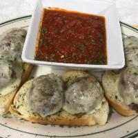 Meatball Bada Bing · 3 homemade meatballs halved and topped with melted mozzarella cheese and side of meat sauce....