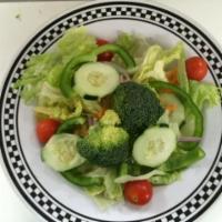 Traditional Garden Salad · Lettuce, tomatoes, onions, cucumbers, bell peppers, carrots and broccoli.