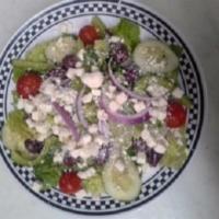 Greek Salad · Romaine lettuce, tomatoes, red onions, cucumbers, bell peppers, broccoli, kalamata olives an...
