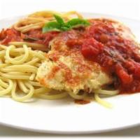Breaded Chicken Parmigiana · Chicken breast hand breaded and deep fried, topped with mozzarella cheese. Served over spagh...