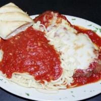 Eggplant Parmigiana · Breaded and deep fried, topped with mozzarella cheese served over spaghetti.