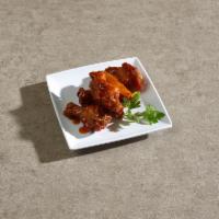 A6. Chicken Wings · 8 piece. Cooked wing of a chicken coated in sauce or seasoning.