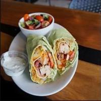 Buffalo Chicken Wrap ·  Tender chicken with cheese, bacon, red onion and greens. Served with Buffalo sauce and blue...