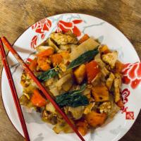 Pad Ki Mao Noodles · Stir-fried flat rice noodles with egg, onion, red pepper, tomato, basil, and house chili sau...