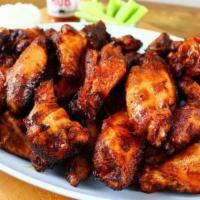 Enzo’s BBQ Wings · 8 pieces. Wings lightly smoked, lightly fried, then dipped in your choice of sweet BBQ or sp...